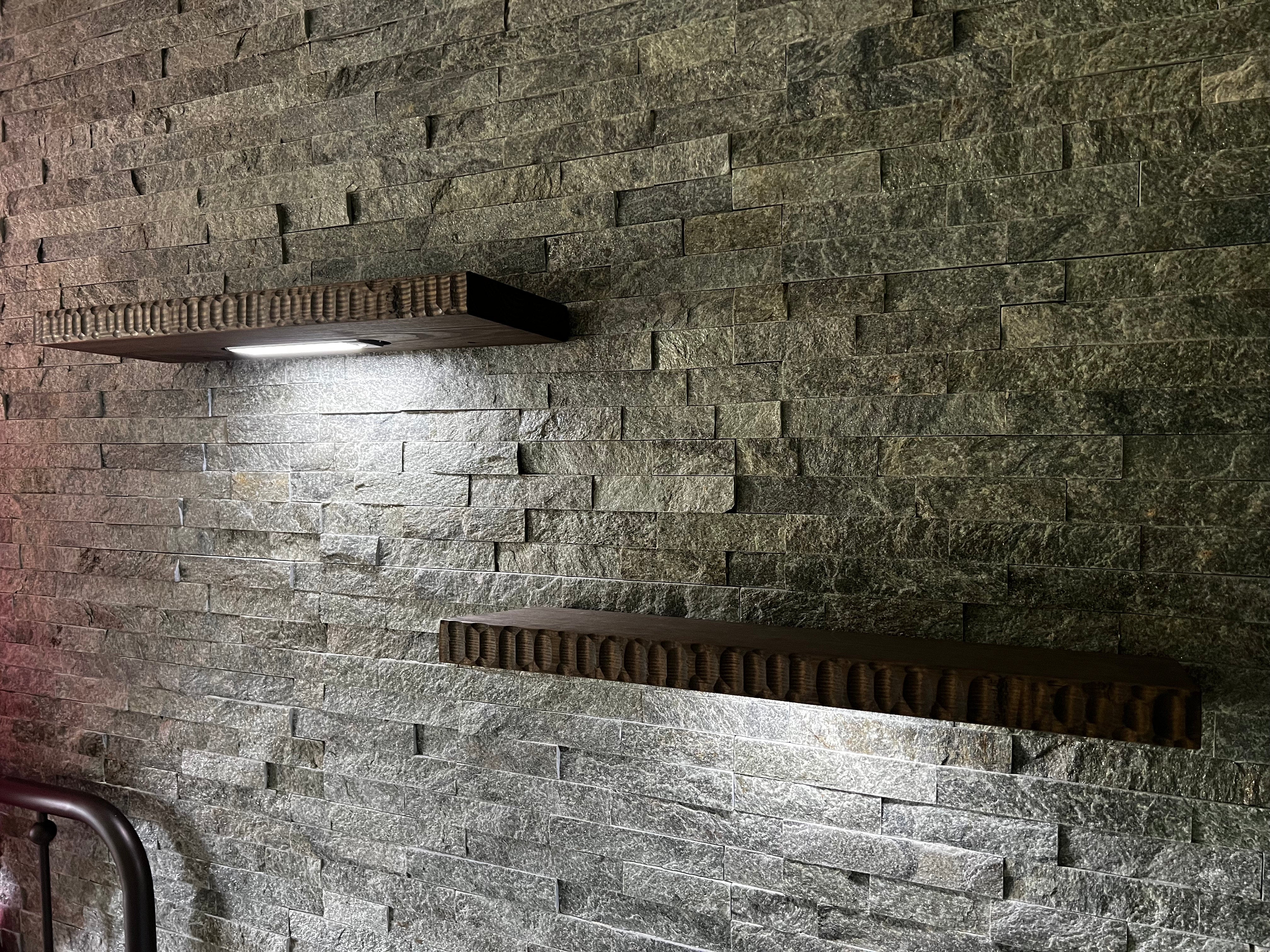 LED-Lighted Floating Shelves on a brick wall