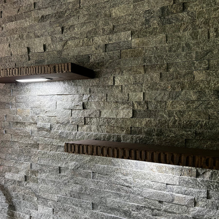 LED-Lighted Floating Shelves on a brick wall